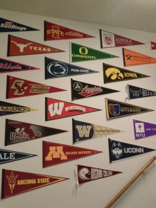 The "graduate school wall." This is a collection of the university pennants of all the different schools that our sociology alumni have attended to receive a graduate degree.